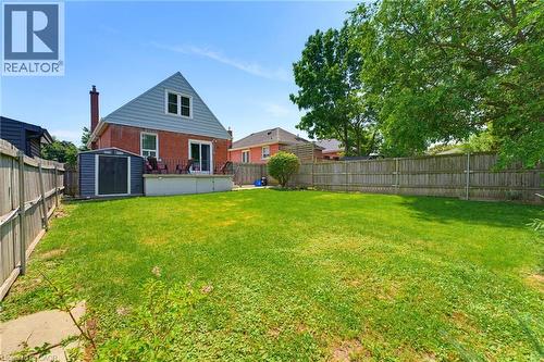 Expansive green lawn with perimeter fencing - 282 East 13Th Street, Hamilton, ON - Outdoor With Backyard