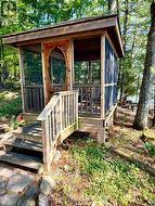 9x12 screened gazebo overlooks lake - 