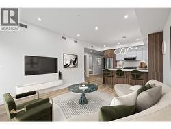 Photo is virtually staged to show possibilities. Photo of a similar floorplan/different colour scheme in building - 