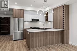 Kitchen & Dining. Photo of a similar floorplan/different colour scheme in building - 