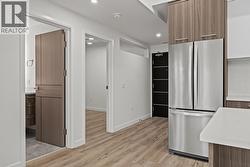 Kitchen & Foyer. Photo of a similar floorplan/different colour scheme in building - 
