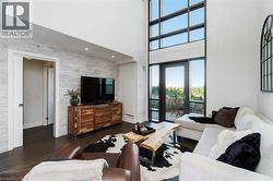 Two-story windows with a glass door to exterior patio - 