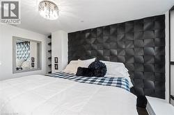 Accent wall featuring dimensional black square panels - 