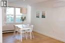 Spacious room featuring wood-finish flooring, white baseboards, and a window with white trim - 919 Montgomery Drive, Ancaster, ON 