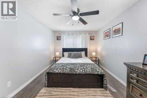 Room featuring wood-finish flooring and light gray walls - 33 Remple Court, Cambridge, ON 