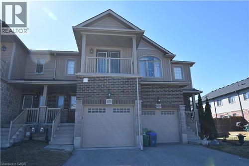 Townhouse exterior featuring a brick and siding facade - 52 Meadowridge Street, Kitchener, ON 