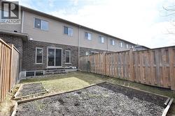 Enclosed backyard with wood privacy fencing - 