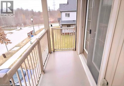 Private balcony with a light-toned floor and matching railings - 52 Meadowridge Street, Kitchener, ON 