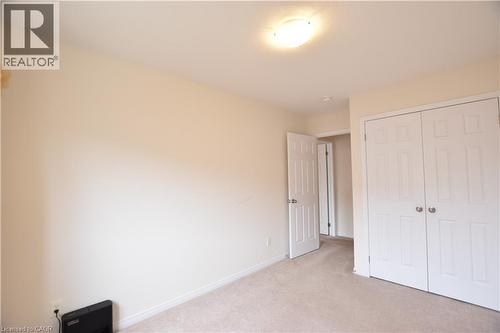 Neutral-toned walls and plush carpeting - 52 Meadowridge Street, Kitchener, ON 