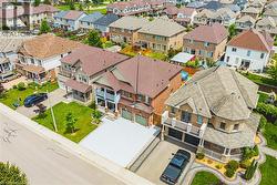 Brick and siding exterior with multiple gables and a multi-level deck - 