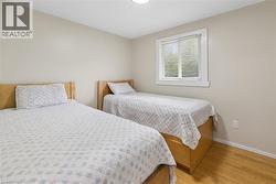 Neutral tone wall paint with wood-finish flooring - 
