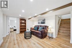 Living area featuring recessed lighting and light wood-style floors - 