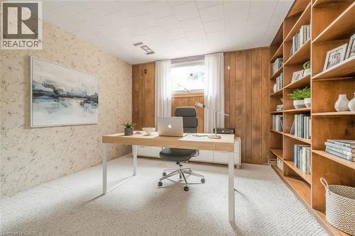 Built-in wood shelving provides extensive storage and display options - 1259 Ernest Avenue, London, ON - Indoor Photo Showing Office