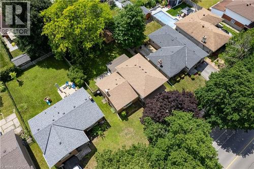Aerial view showcasing a residential property with a gray shingle roof and a spacious green lawn - 99 Lorraine Avenue, Kitchener, ON - Outdoor With View