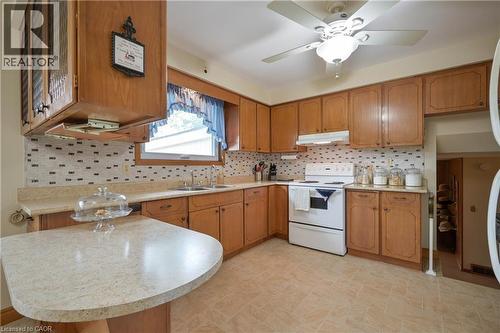 Kitchen featuring light wood cabinetry and light-toned countertops - 99 Lorraine Avenue, Kitchener, ON - Indoor Photo Showing Kitchen With Double Sink