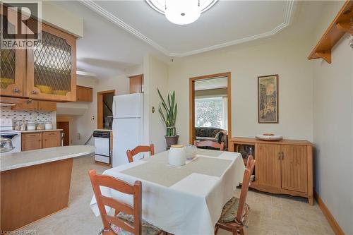 Dining area featuring crown molding and a built-in wall shelf - 99 Lorraine Avenue, Kitchener, ON - Indoor Photo Showing Dining Room