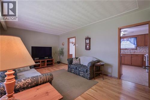 Living area featuring hardwood flooring and light green walls - 99 Lorraine Avenue, Kitchener, ON - Indoor