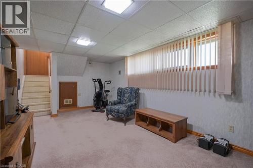 Finished lower level featuring carpeted flooring and drop ceiling with recessed lighting - 99 Lorraine Avenue, Kitchener, ON - Indoor Photo Showing Basement