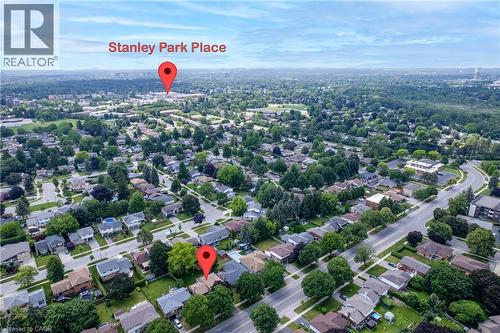Aerial perspective showcasing a residential neighborhood with tree-lined streets and established homes - 99 Lorraine Avenue, Kitchener, ON - Outdoor With View