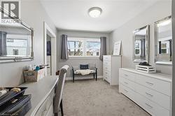 Office with light colored carpet and baseboards - 