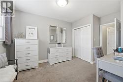 Office area with light carpet and baseboards - 