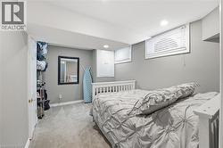 Bedroom with light carpet and recessed lighting - 