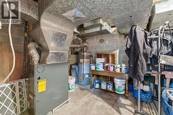 Utility room with gas water heater and heating unit - 