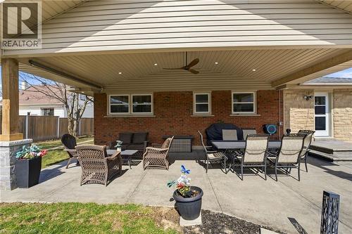 View of patio with ceiling fan and outdoor lounge area - 473 Mohawk Road W, Hamilton, ON 