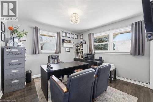 Office area with dark wood finished floors and baseboards - 473 Mohawk Road W, Hamilton, ON 