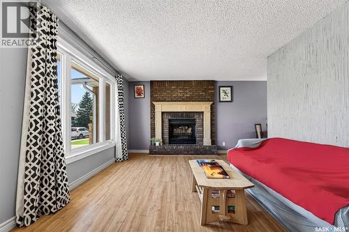 22 Edelweiss Crescent, Moose Jaw, SK - Indoor Photo Showing Living Room With Fireplace