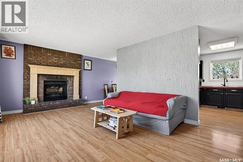 22 Edelweiss Crescent, Moose Jaw, SK - Indoor Photo Showing Living Room With Fireplace