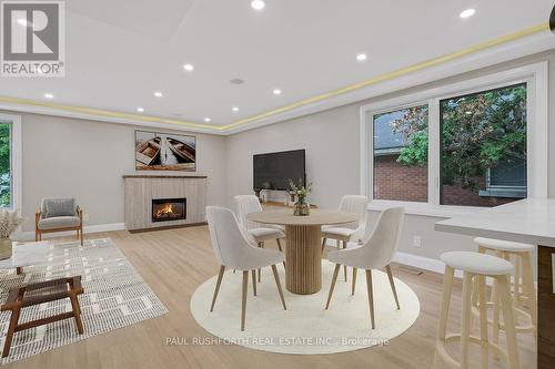 Virtually STaged Dining Room - 668 Fraser Avenue, Ottawa, ON - Indoor Photo Showing Other Room With Fireplace