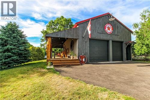 20 x 30 detached heated garage with car lift - 657 Windham Road 14 Road, Simcoe, ON - Outdoor With Deck Patio Veranda