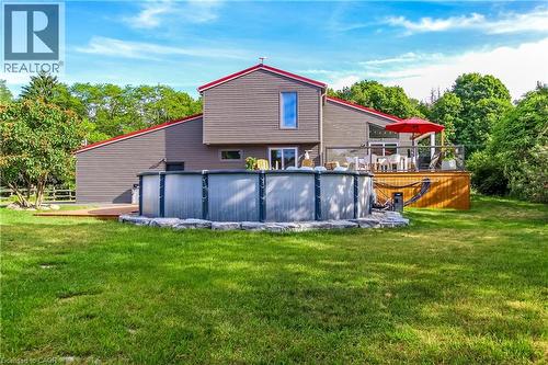 657 Windham Road 14 Road, Simcoe, ON - Outdoor With Above Ground Pool With Deck Patio Veranda