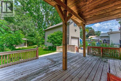 Spacious wooden deck with a covered area and perimeter railings - 84 Franklin Street S, Kitchener, ON - Outdoor With Deck Patio Veranda With Exterior