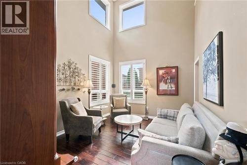 Living room with soaring ceilings open to upper level and lots of natural light - 207 Valridge Drive, Ancaster, ON - Indoor