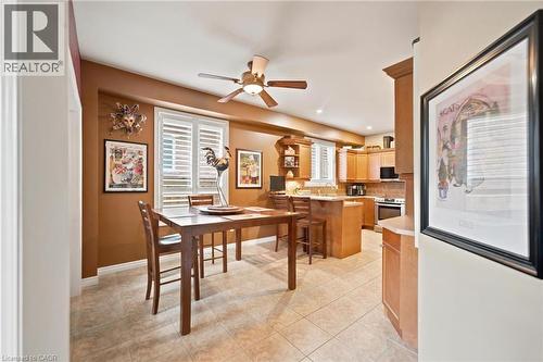 Open-concept kitchen and breakfast area featuring tile flooring and california shutters - 207 Valridge Drive, Ancaster, ON - Indoor Photo Showing Dining Room