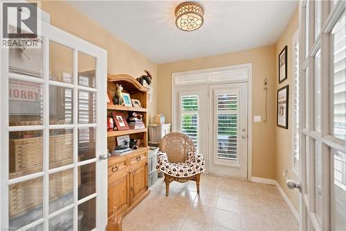 Sun Room leading to backyard featuring california shutters - 207 Valridge Drive, Ancaster, ON - Indoor