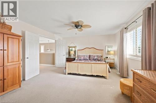 Bright primary bedroom featuring light-toned carpeting and neutral wall tones - 207 Valridge Drive, Ancaster, ON - Indoor Photo Showing Bedroom