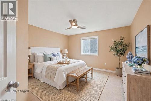 Bedroom featuring neutral wall colours, a ceiling fan with integrated lighting, and carpet flooring - 207 Valridge Drive, Ancaster, ON - Indoor Photo Showing Bedroom