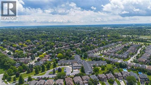 Aerial perspective showcasing a residential area with extensive tree canopy - 207 Valridge Drive, Ancaster, ON - Outdoor With View