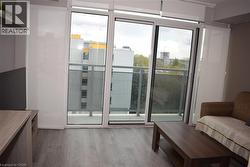 Sliding glass door balcony access with a glass railing - 