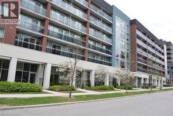 Multi-story building featuring brick and blue paneling facades - 