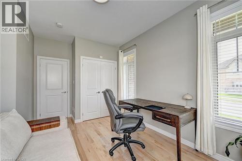Light wood-finish flooring complements the neutral wall tones - 219 Falconridge Drive, Kitchener, ON - Indoor Photo Showing Office