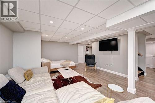 Finished lower level featuring recessed lighting and wood-finish flooring - 219 Falconridge Drive, Kitchener, ON - Indoor