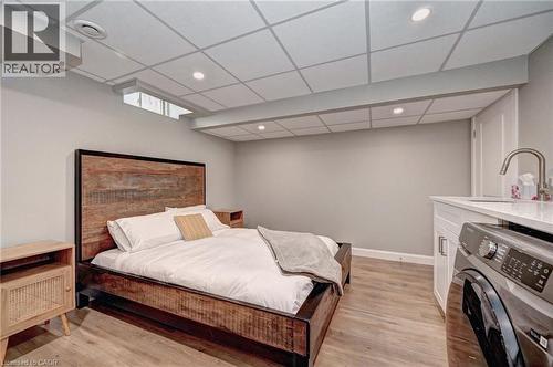 Spacious room featuring wood-finish flooring, recessed lighting, and a drop ceiling - 219 Falconridge Drive, Kitchener, ON - Indoor Photo Showing Bedroom