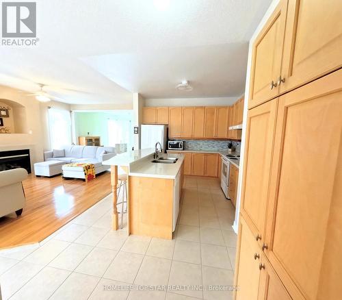 26 Delray Drive E, Markham, ON - Indoor Photo Showing Kitchen With Fireplace With Double Sink