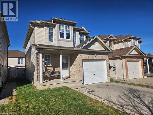 View of front facade featuring a garage and a porch - 973 Atlantic Boulevard, Waterloo, ON - Outdoor With Facade