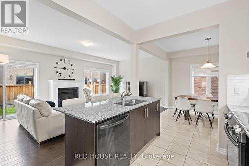 46 Dolobram Trail, Brampton, ON - Indoor Photo Showing Kitchen With Fireplace With Double Sink