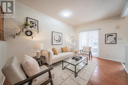 17 - 12 St Moritz Way, Markham, ON - Indoor Photo Showing Living Room With Fireplace